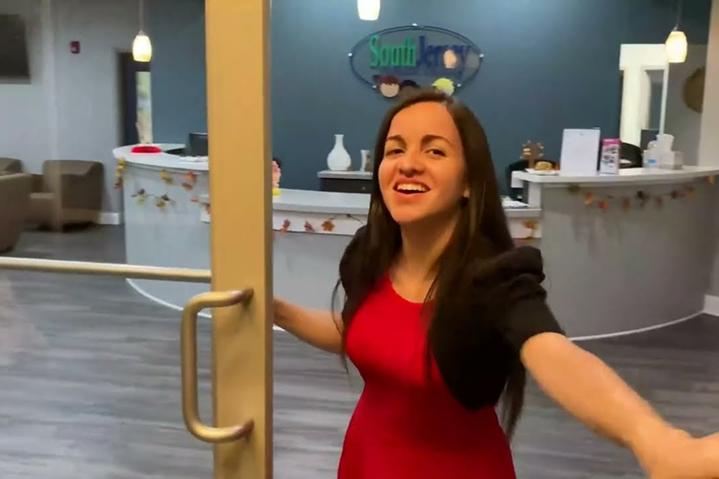 Dentist is smiling and welcoming new patients