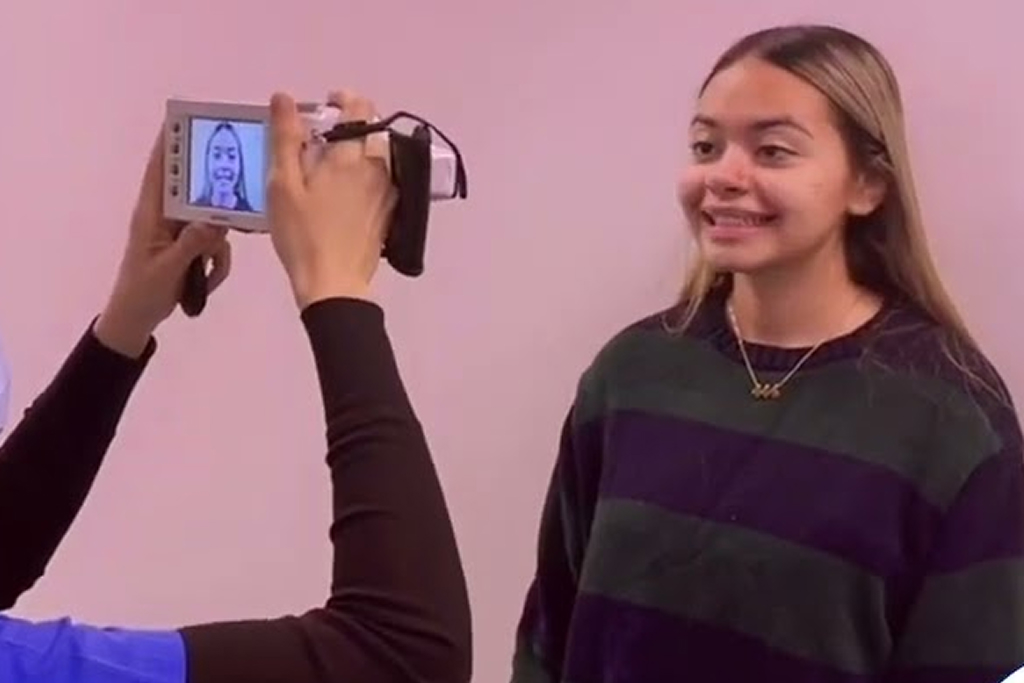 Dentist is making photo of a smiling patient